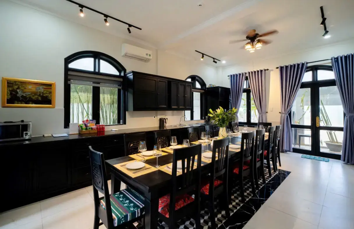 Spacious dining and kitchen area in a Da Nang classic villa with high ceilings and refined details